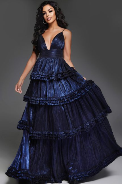 model wearing 38296 navy gown with V-neckline and layered ruffles, front view