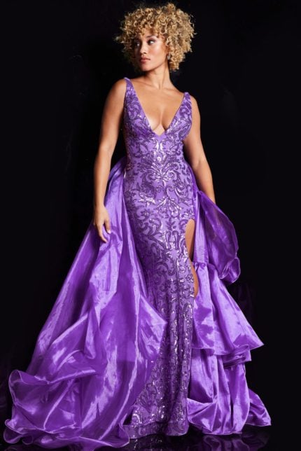 Model showcasing Jovani 38336 purple gown with high slit and layered skirt