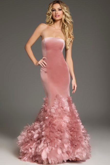 Model wearing Jovani 38496 pink strapless mermaid dress with ruffled details.