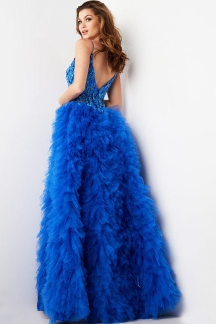 Model showcasing the back of Jovani 38523 royal blue gown with detailed beadwork