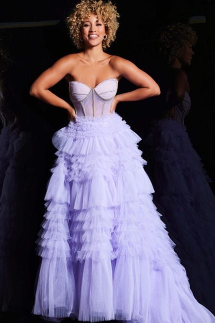 Model wearing Jovani 38539 lilac gown featuring a layered ruffle skirt, front view.