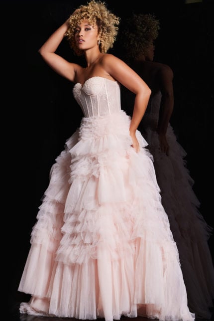 Model presenting Jovani 38540 pink ball gown with lace bodice and tulle layers.