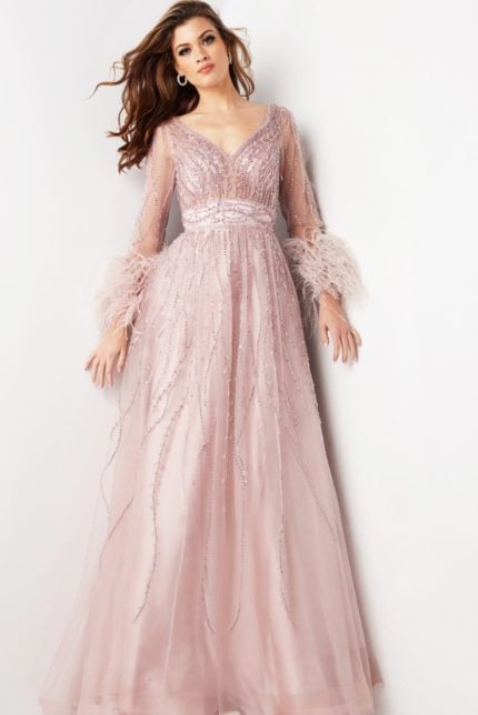 Model wearing Jovani 38583 blush gown with V-neckline and beaded details, front view.