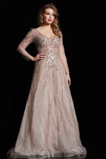 Model wearing Jovani 38589 gold gown with V-neckline and long sleeves, view from the front