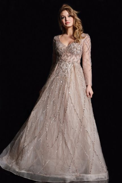 Model wearing Jovani 38589 gold gown, featuring intricate embellishments, front view