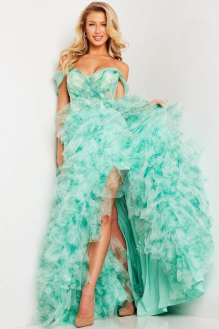 Model wearing Jovani 38606 green dress with off-the-shoulder neckline and cascade tulle layers.