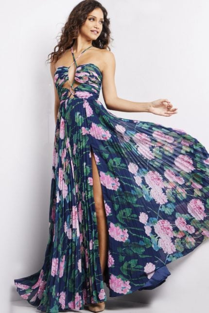 Model wearing Jovani 38638 navy floral dress with sweetheart neckline and pleated skirt.