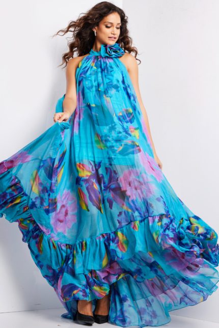 Model showcasing Jovani 38721 flowing printed dress, emphasizing vibrant blues and purples.