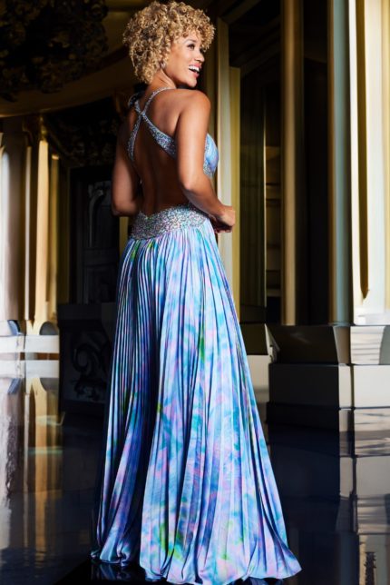 Back view of model wearing Jovani 38722 dress showing open back design.