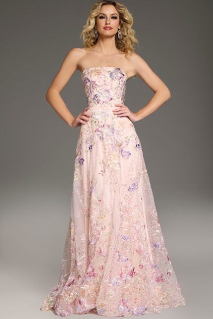 Model wearing Jovani 39144 pink dress, strapless with floral embroidery, full front view.