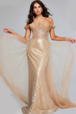 Model wearing Jovani 39389, an off-the-shoulder brown gown with sequin bodice and flowing sheer skirt.