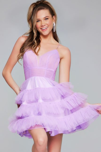 Model wearing Jovani 39656 lilac ruffled short dress with V-neckline.