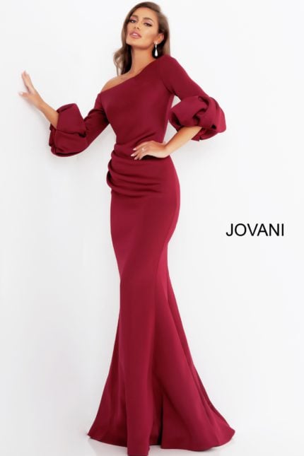 Model wearing Jovani 39739 burgundy gown with off-the-shoulder neckline and mermaid silhouette.