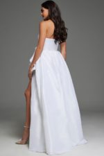 Model wearing Jovani 39796 white dress with ruffled shoulder detail, back view.