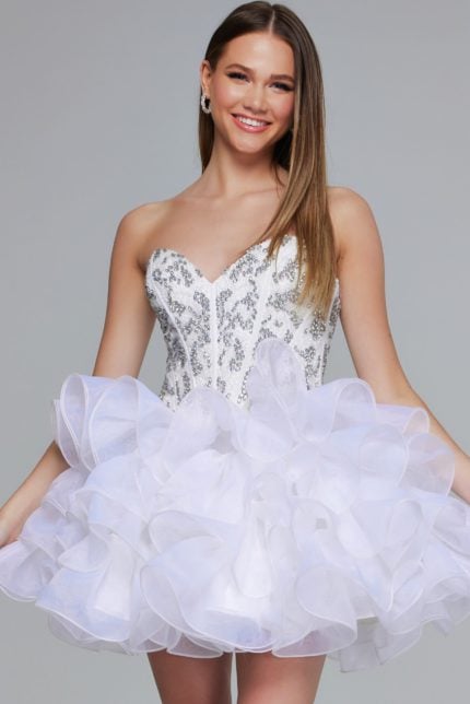 Model wearing Jovani 39932 off-white dress with ruffled tulle layers and sequin bodice.