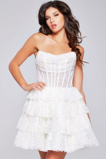 Model wearing Jovani 40030 white dress with a strapless design and tiered skirt, front view close-up.