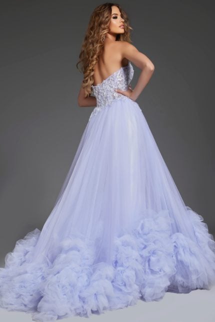 Model wearing Jovani 40170 blue ballgown from the back, showcasing elegant tulle layers.