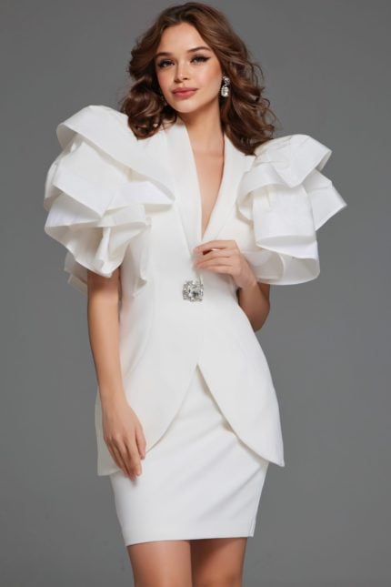 Model wearing Jovani 40292 ivory dress with ruffled sleeves, front view.