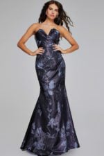 Model wearing Jovani 40309 gown with emphasis on structured bodice and floral accents from front view.