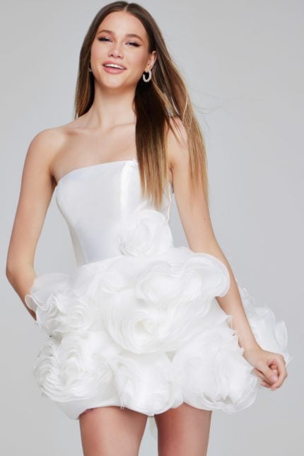 Model wearing Jovani 40334 white mini dress, showcasing floral appliqués and a strapless neckline