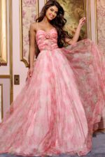 Model wearing Jovani 40402 pink floral A-line gown, front view.