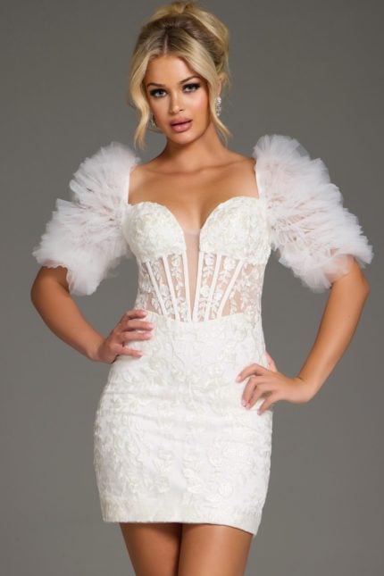 Model wearing Jovani 40426 mini dress with sweetheart neckline and puff sleeves in white.