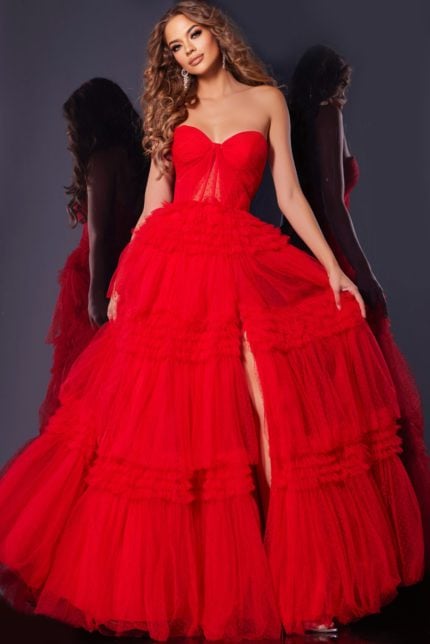 Model wearing Jovani 40466 red tulle gown with sweetheart neckline and high slit