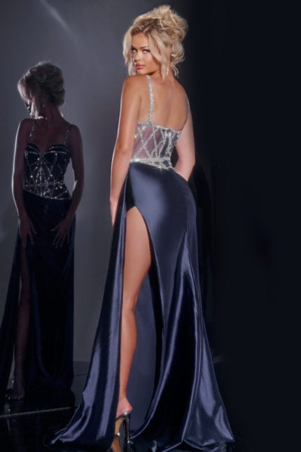 Model showcasing Jovani 40506 navy gown with intricate beaded design, back view.