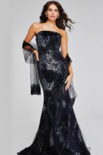 Model wearing Jovani 40604 black dress with floral embroidery and strapless neckline, front view.