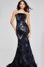 Model in Jovani 40604 black dress with elegant mermaid silhouette, front view.