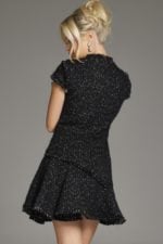 Back view of model in Jovani 40659 black dress showing detailed texture.