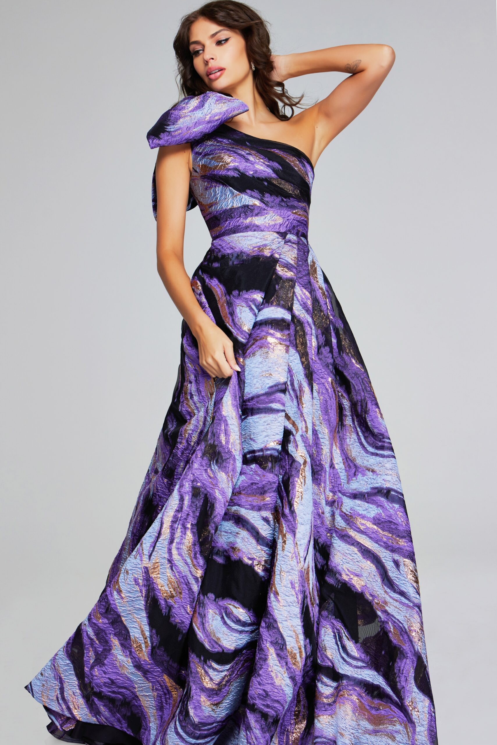 Model wearing Vibrant Purple Multi-Print One-Shoulder Gown with Bow Detail 40695