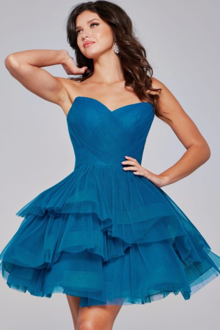 Model wearing Jovani 41054 blue dress showcasing sweetheart neckline and layered tulle, front view.