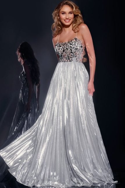 Model wearing Jovani 41117 silver dress with illusion neckline and A-line silhouette front view.