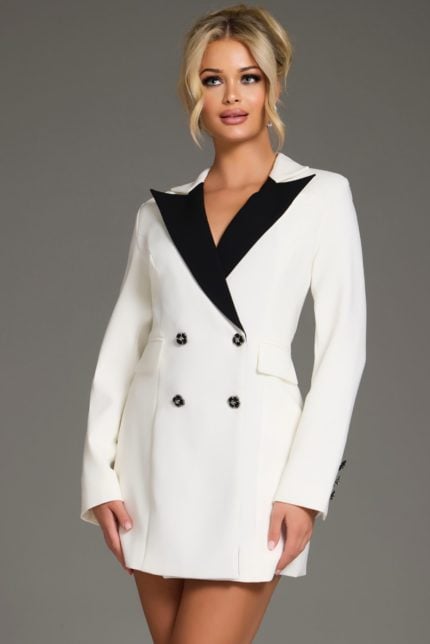 Model wearing Jovani 42124 white mini dress with black lapel, front view.