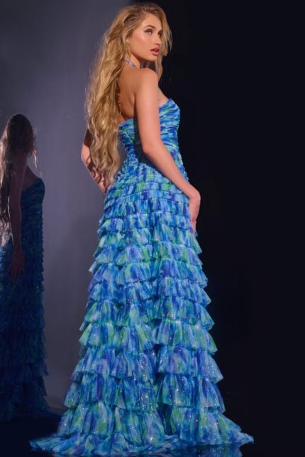 Model wearing Jovani 42182 royal dress, back view showing layered ruffles.