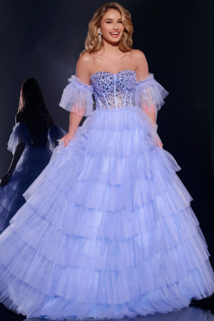 Model wearing Jovani 42249 blue gown with off-the-shoulder neckline and layered tulle skirt.