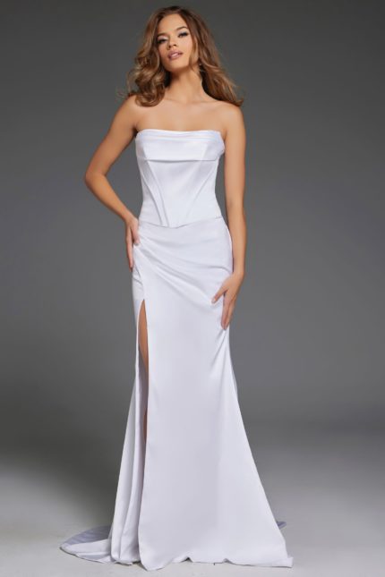 Model wearing Jovani 42355 elegant white dress with strapless neckline and high slit