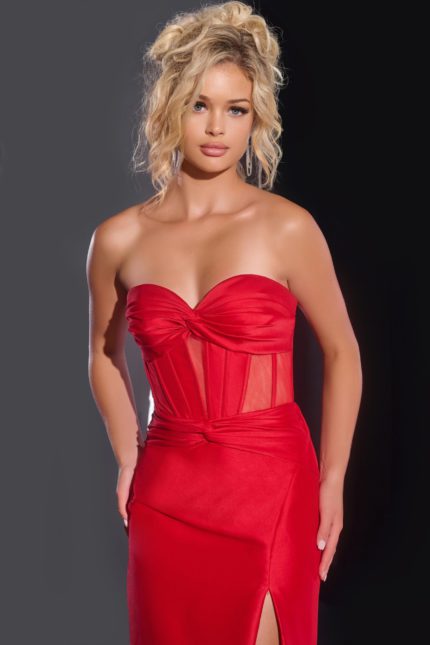 Close-up of model in Jovani 42375 red gown showing sheer bodice detail.