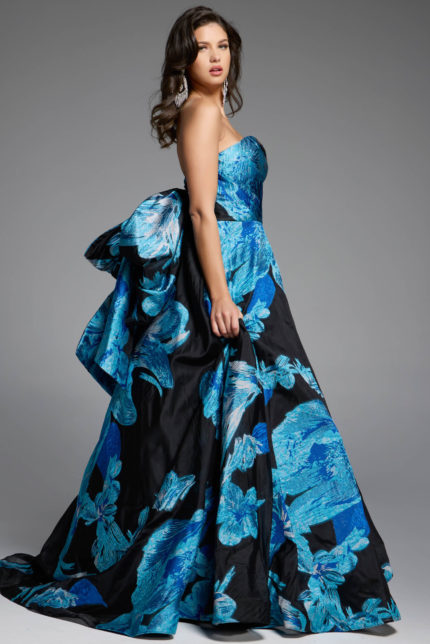 Strapless black ball gown with blue floral print and dramatic bow detail.