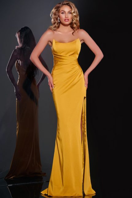 Model wearing Jovani 42765 yellow gown with straight neckline and high slit