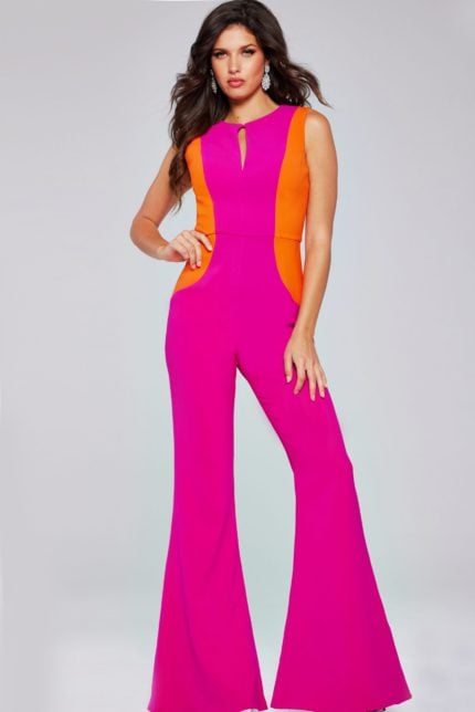 Model wearing Jovani 42801 jumpsuit in fuchsia with orange panels, front view.