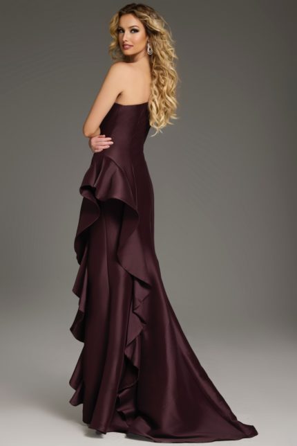 Back view of model in Jovani 43126 dress featuring cascading ruffles in brown.