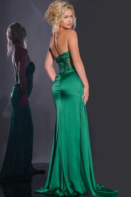 Back view of model wearing Jovani 43157 emerald green gown with fitted silhouette