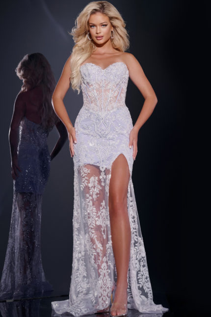 Model wearing Jovani 43184 lilac gown with lace detailing and high slit, front view.