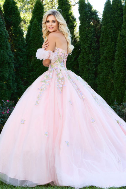 Back view of model wearing Jovani 43231 lilac ball gown showing floral appliqués.