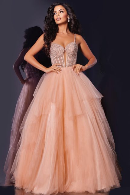 Model wearing Jovani 43254 blush ball gown with beaded bodice and tulle skirt