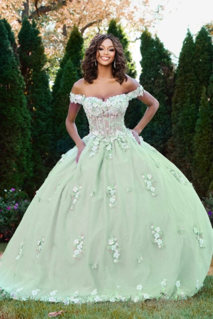 Model wearing Jovani 43811 green ball gown with floral detail, front view.