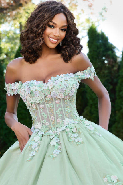 Model wearing Jovani 43811 green ball gown, detailed front bodice view.