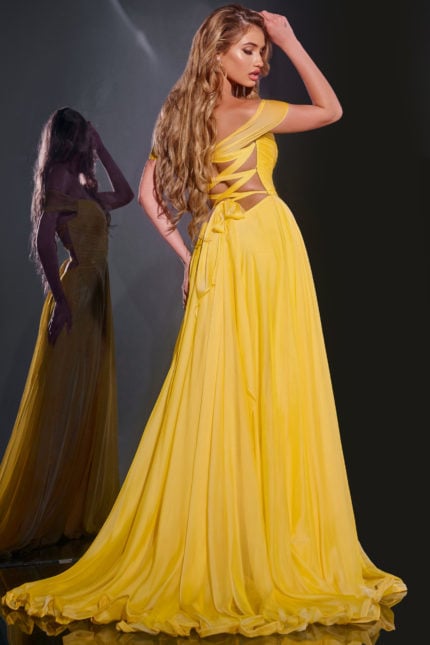 Model wearing Jovani 43842, front view of yellow gown with off-the-shoulder neckline and high slit.